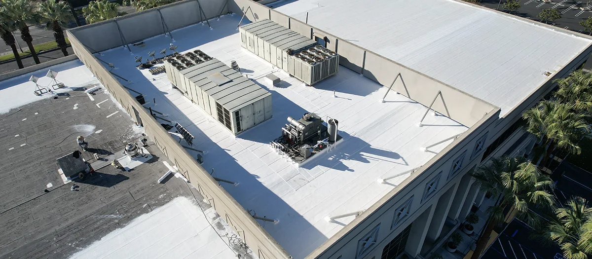 Commercial building roof with expertly applied coating