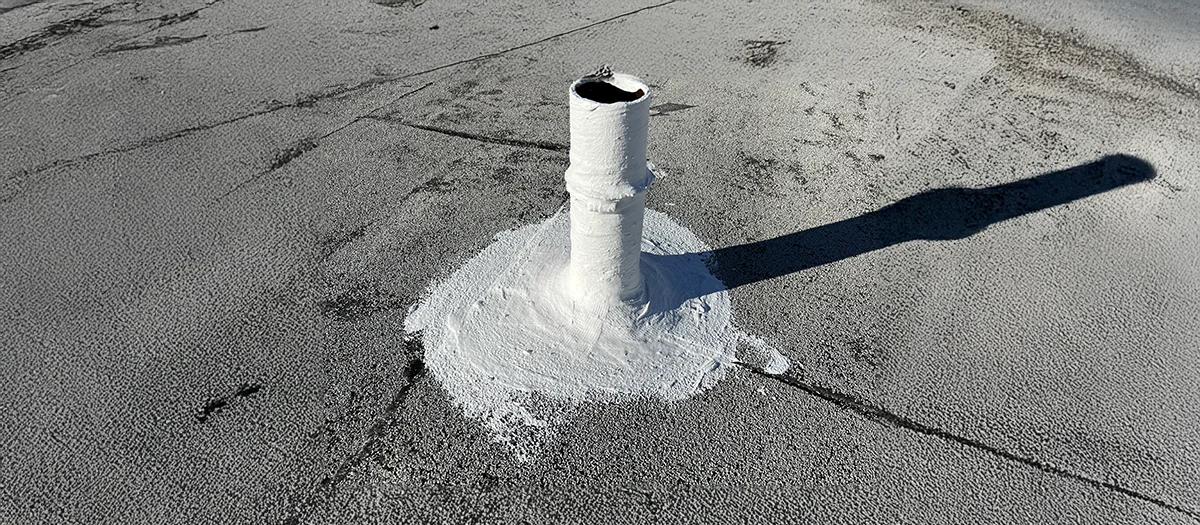 Commercial building roof with expertly applied coating