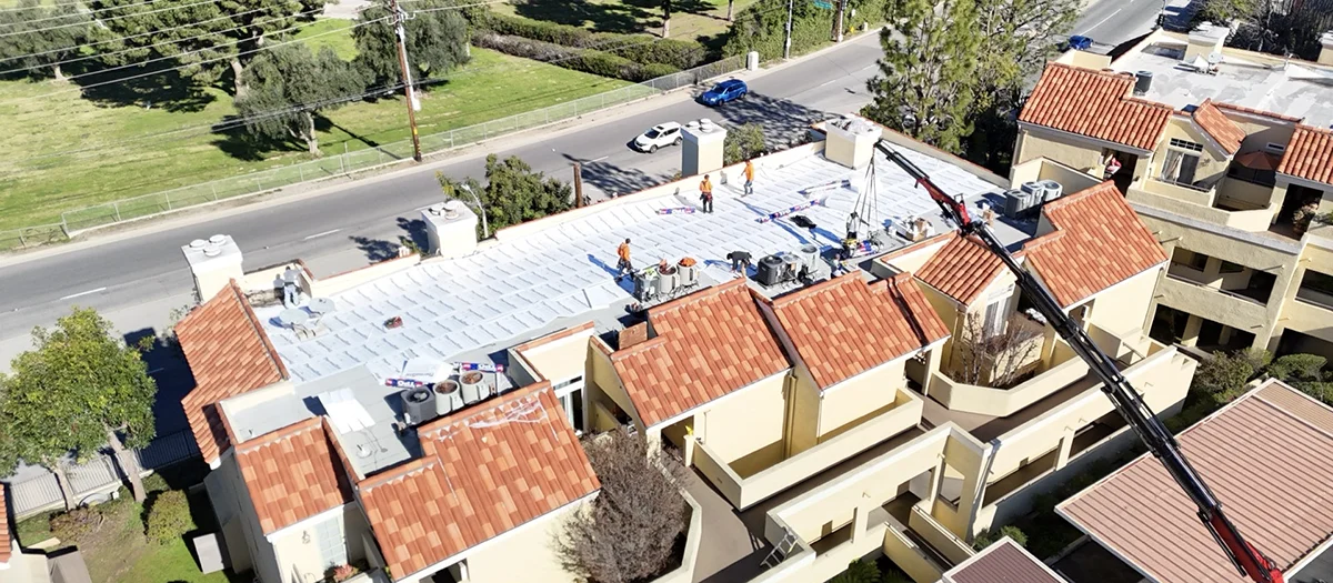 Weathered commercial building roof in need of repairs